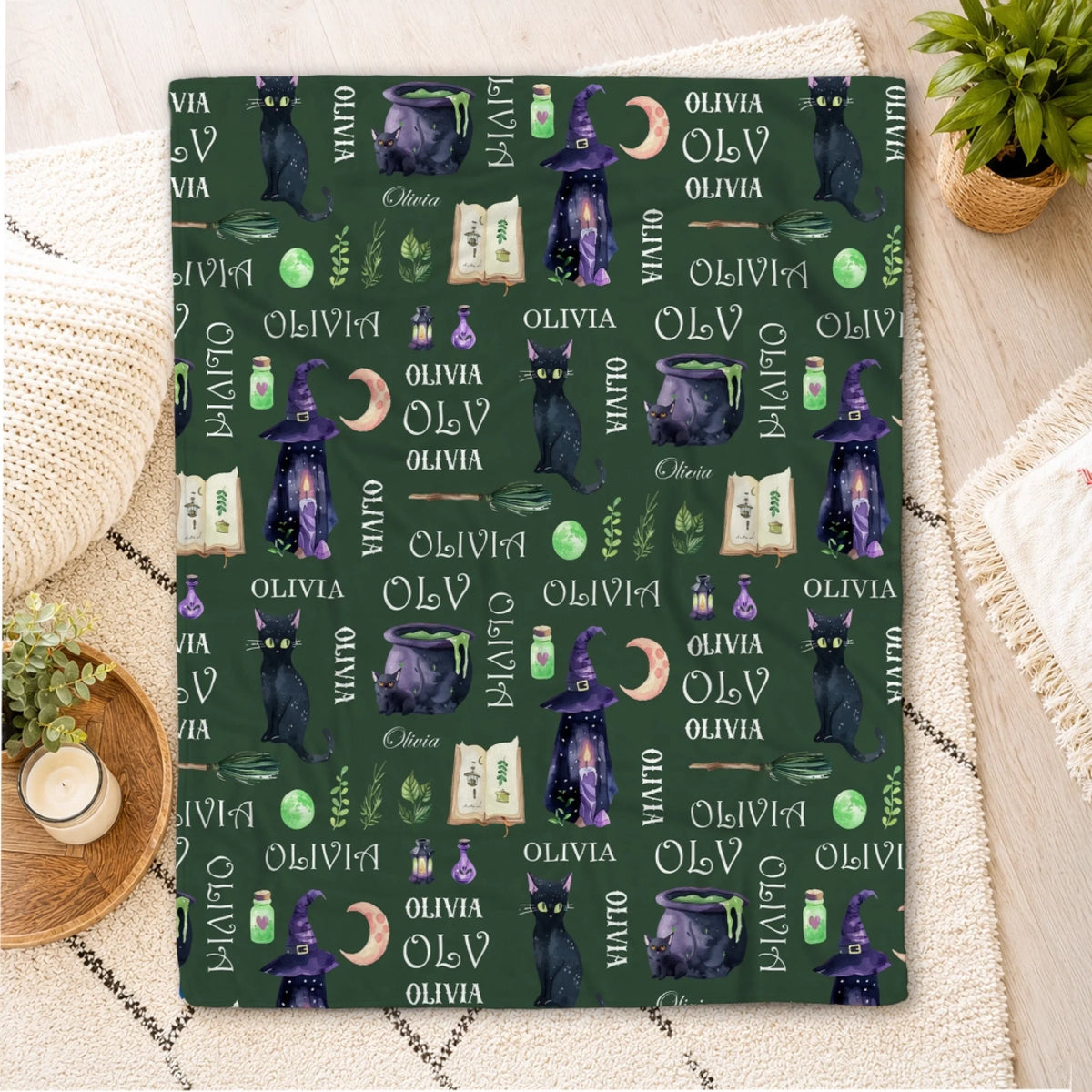 Custom dark green throw blanket with personalized Olivia name witchy icons like cats cauldrons and magic potions.