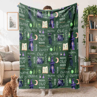 Custom name Olivia Halloween fleece blanket featuring black cats, witch hats, cauldrons, and potions for spooky decor.