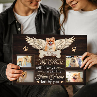A person holding a custom pet sympathy canvas with angel wings and the heartfelt quote My heart will wear the print.