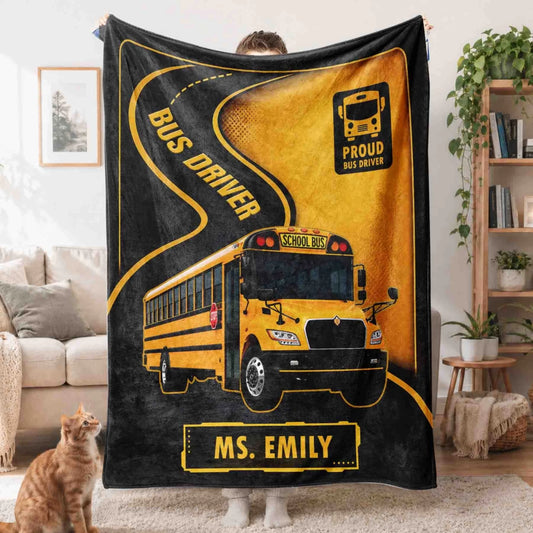 A personalized Proud Bus Driver fleece throw blanket featuring a yellow school bus and the custom name Ms. Emily.
