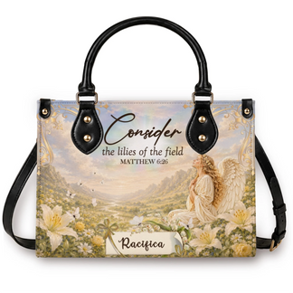 A personalized handbag featuring a beautiful angel in a field of lilies with the scripture quote Consider the lilies of the field Matthew 6 26