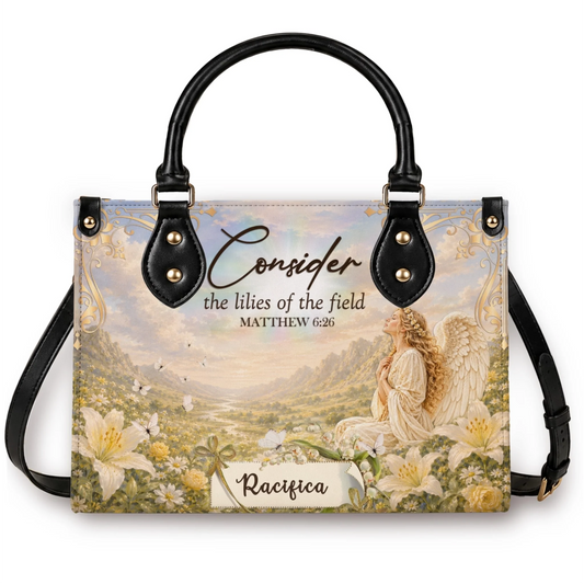 A personalized handbag featuring a beautiful angel in a field of lilies with the scripture quote Consider the lilies of the field Matthew 6 26