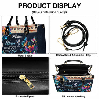 Detailed view of custom handbag features including adjustable strap zipper and metal buckles with religious design