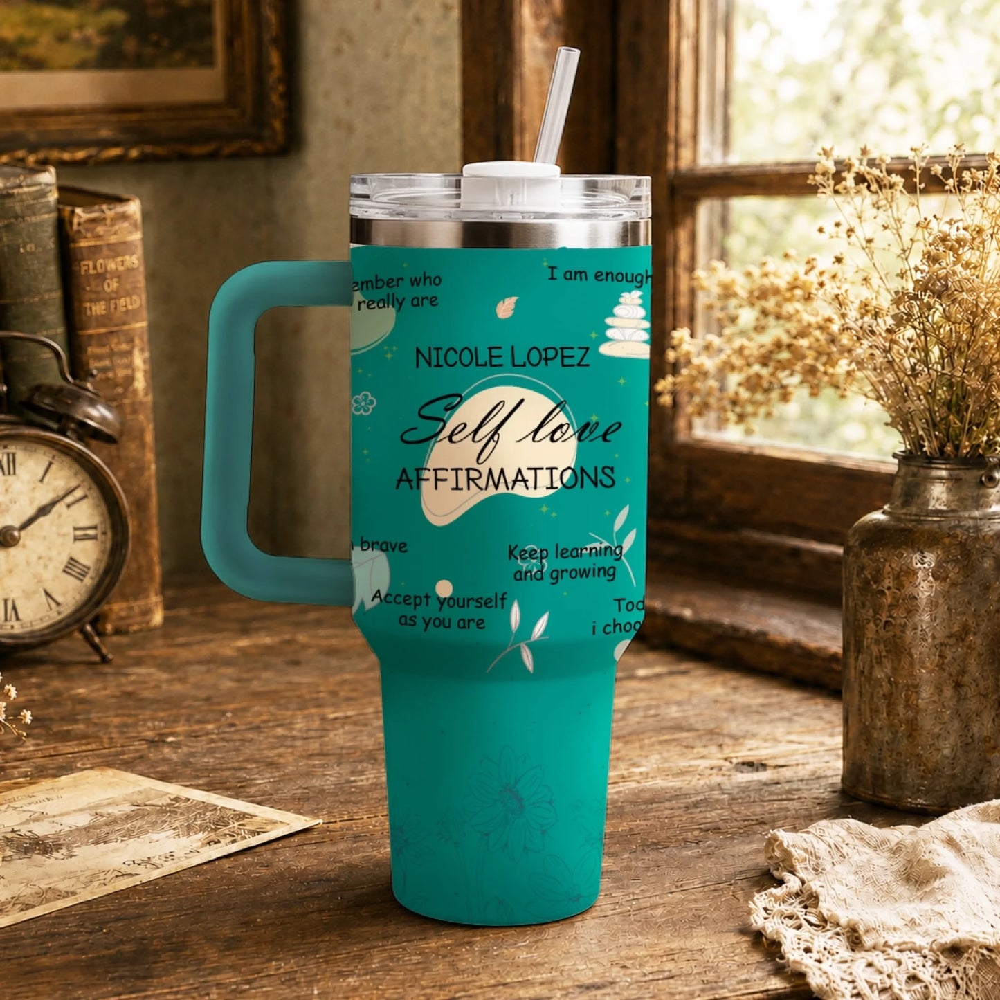 A teal personalized tumbler featuring self love affirmations and custom name Nicole Lopez with floral design elements.