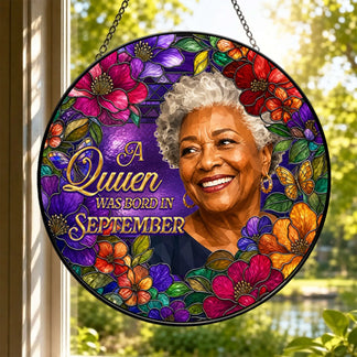 Stained glass effect acrylic suncatcher featuring a September queen design and colorful floral arrangement.
