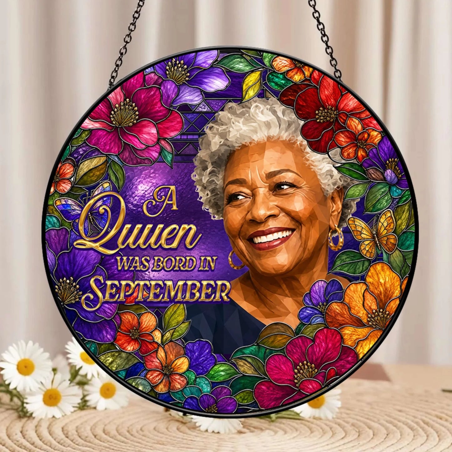 Decorative September birthday suncatcher with custom queen portrait and vibrant floral stained glass design.