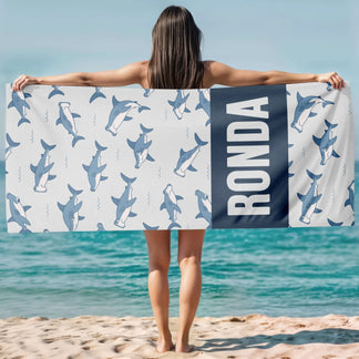 Customized beach towel featuring a cute hammerhead shark pattern and the name Ronda for shark lovers at the beach.