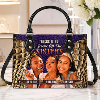 A custom sisters handbag showcasing a personalized photo and the quote There Is No Greater Gift Than Sisters.