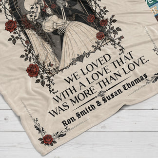 Close up of a personalized fleece blanket showing the gothic skeleton couple design and custom names for a wedding or anniversary gift.