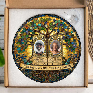 Personalized memorial suncatcher featuring a family tree with custom photos, names, years, and the quote Your roots remain Your love lives on