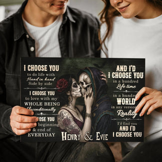 Couple holding a personalized sugar skull canvas wall art printed with the names Henry and Evie for a romantic gift.
