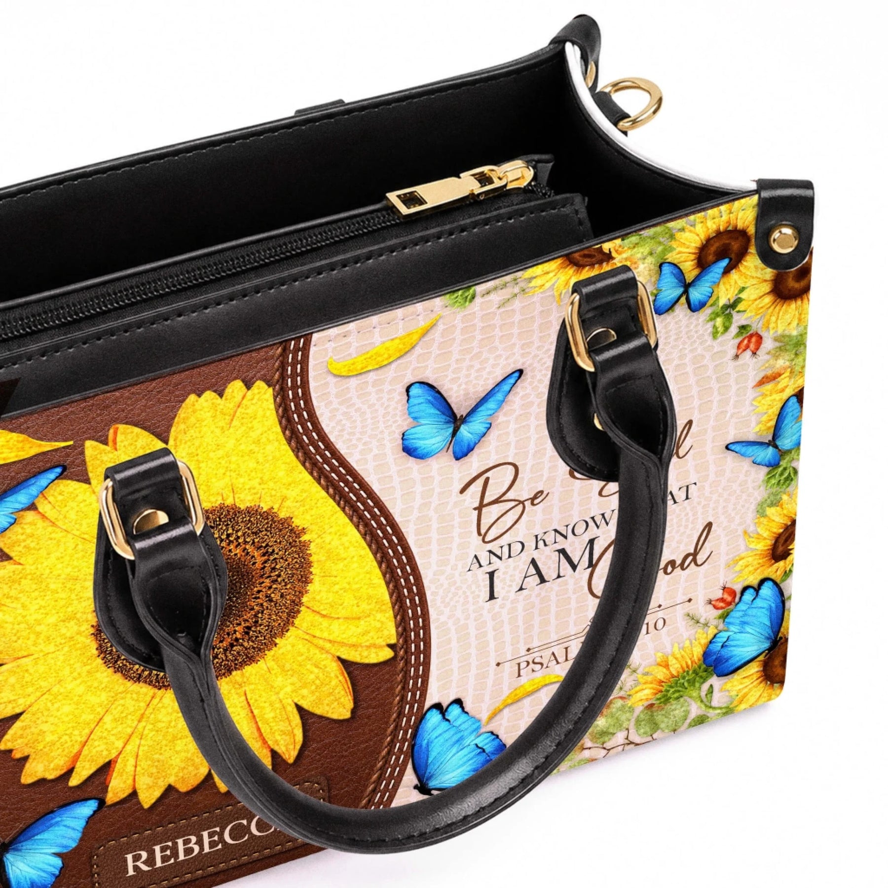 Personalized PU leather handbag featuring sunflower and butterfly artwork with custom name and Psalm 46 10 Bible verse.