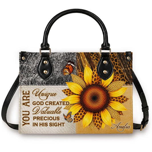 A personalized tote bag featuring a sunflower and butterfly design with the custom name Amelia and an inspirational quote.