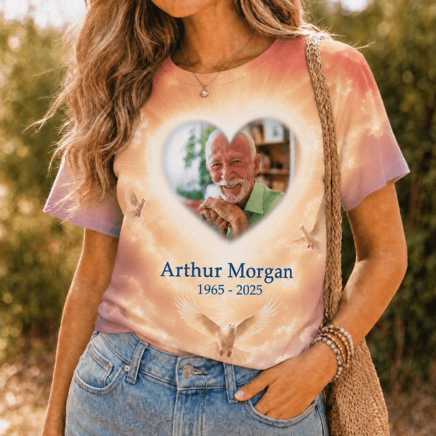 Woman wearing a personalized sympathy t-shirt with a custom photo heart frame and memorial dove graphics.