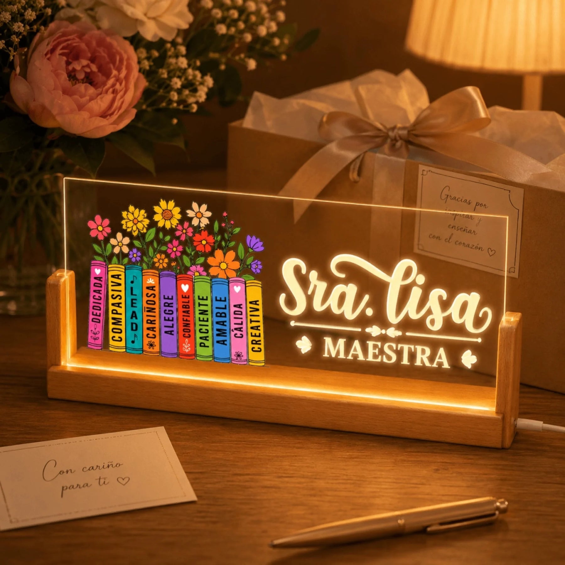 Custom teacher gift LED desk lamp with Sra Lisa and floral books design displayed with a thank you card and gift