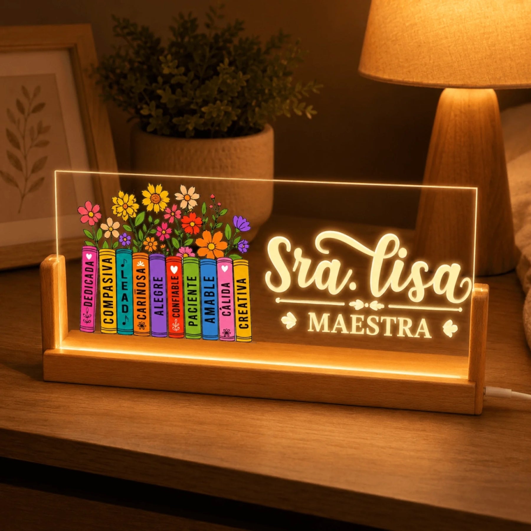 A custom LED acrylic night light for teachers featuring Sra Lisa and a stack of books with floral and uplifting text.