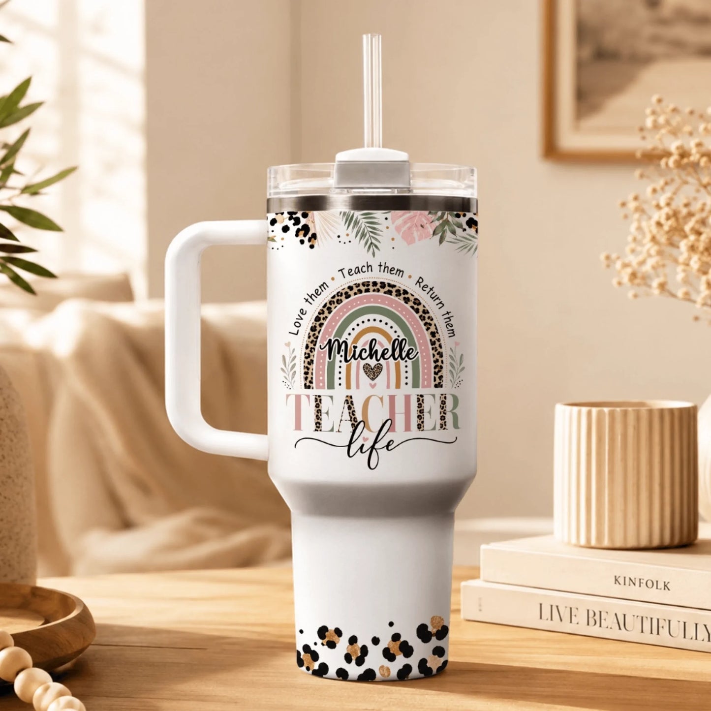 Custom 40oz stainless steel teacher tumbler with a colorful leopard rainbow design and name Michelle, perfect for school.