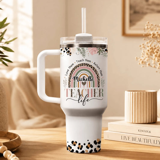 Custom 40oz stainless steel teacher tumbler with a colorful leopard rainbow design and name Michelle, perfect for school.