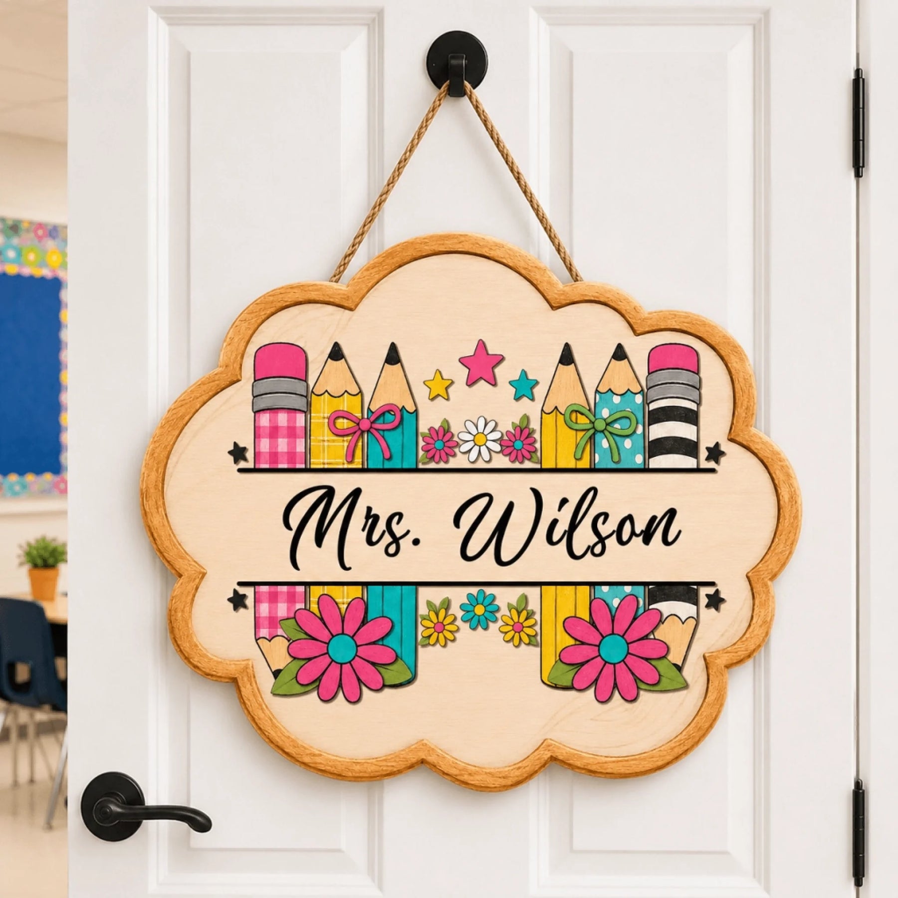 Custom wooden classroom sign featuring pencils and flowers with the name Mrs Wilson for teacher appreciation gift.