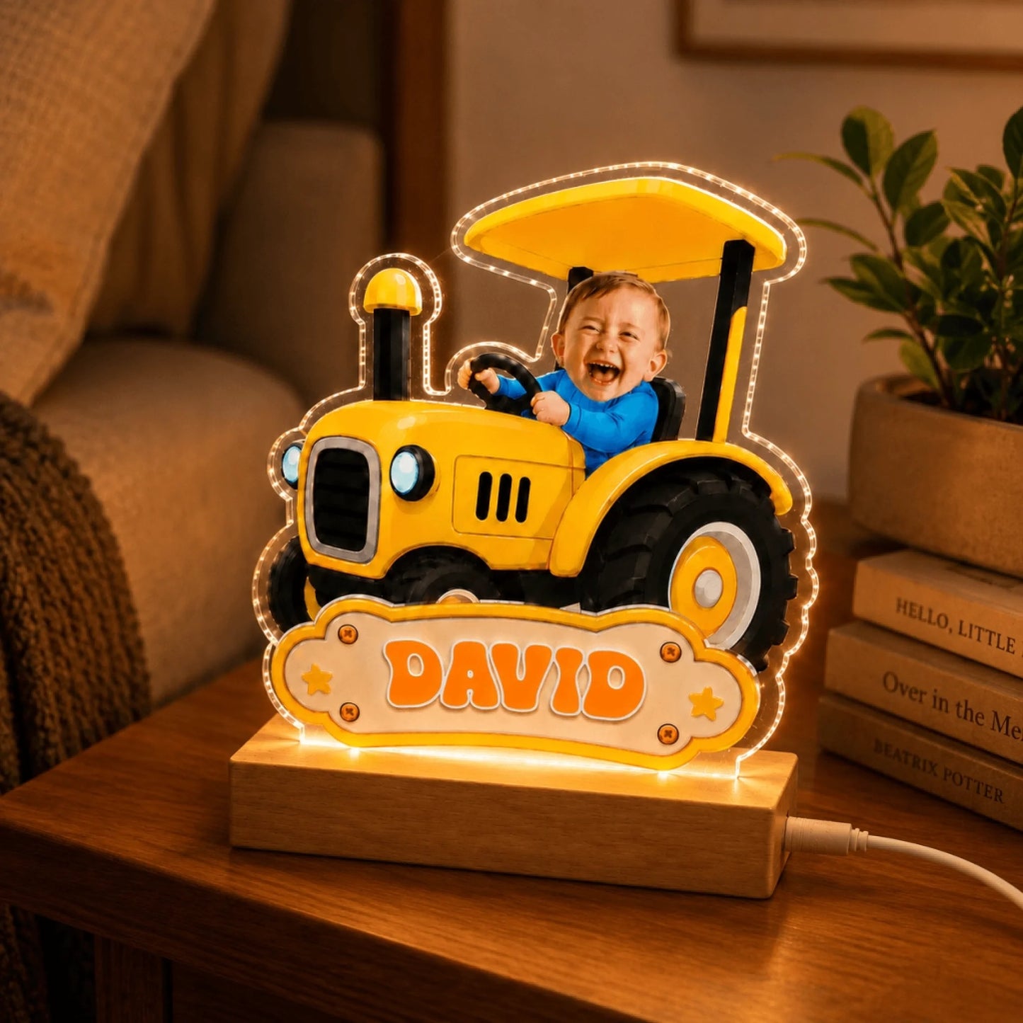 Custom acrylic tractor night light with baby David photo and wooden base, perfect bedroom decor for kids.