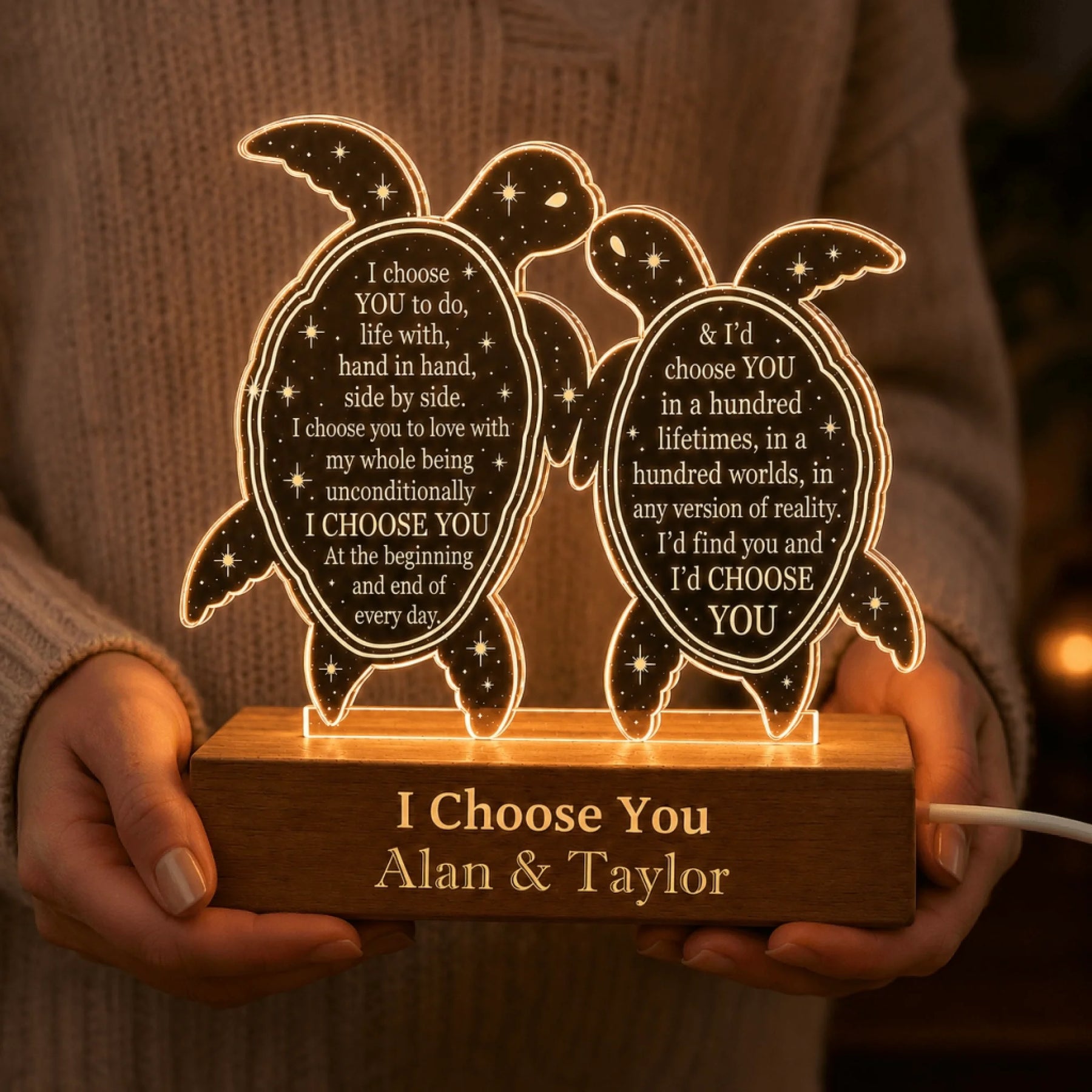 Holding a personalized turtle LED lamp for couples featuring romantic quotes, ideal for anniversary or romantic gifts.