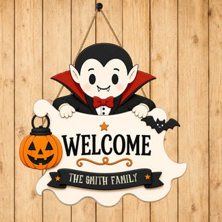 Personalized Smith family Halloween welcome sign featuring a cute vampire character, hanging on a rustic wood background.