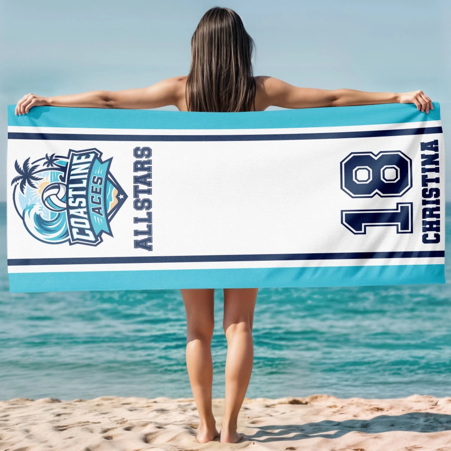 Woman holding a personalized Coastline Aces volleyball beach towel customized with the name Christina and number 18