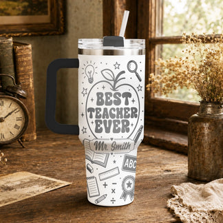 White stainless steel teacher tumbler featuring school themed graphics and personalized custom name text.