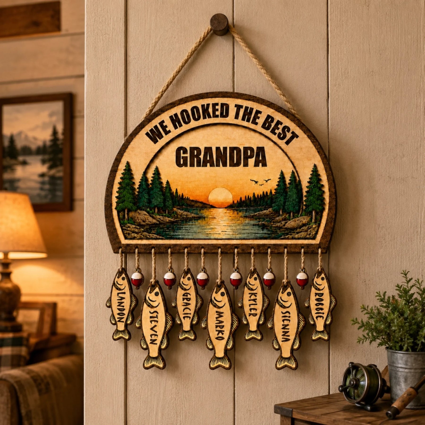 Handcrafted wooden wall hanging for grandpa with a fishing theme and personalized fish-shaped name tags for grandkids.