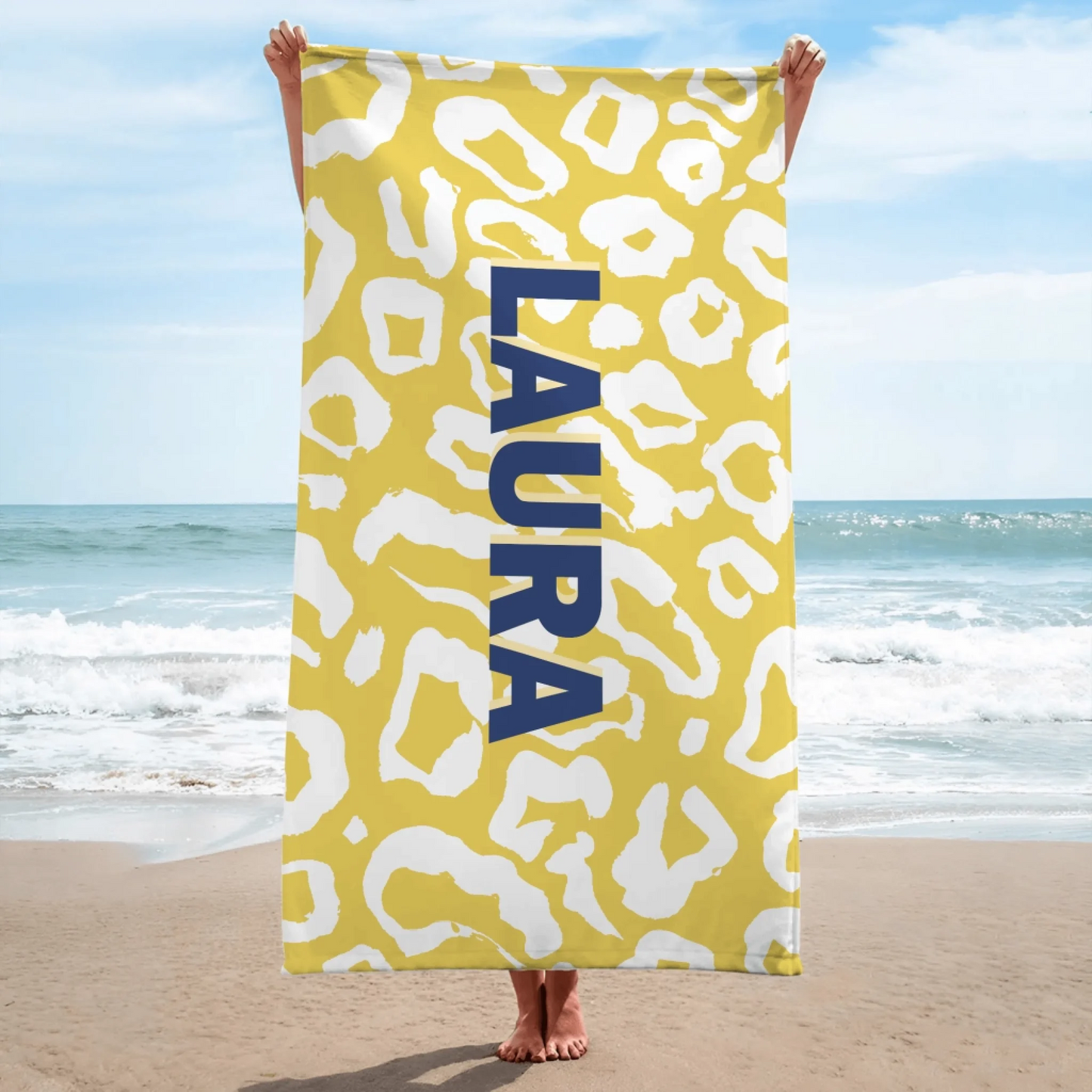 Custom yellow leopard print beach towel featuring the name Laura, a stylish personalized gift for pool parties and beach lovers.