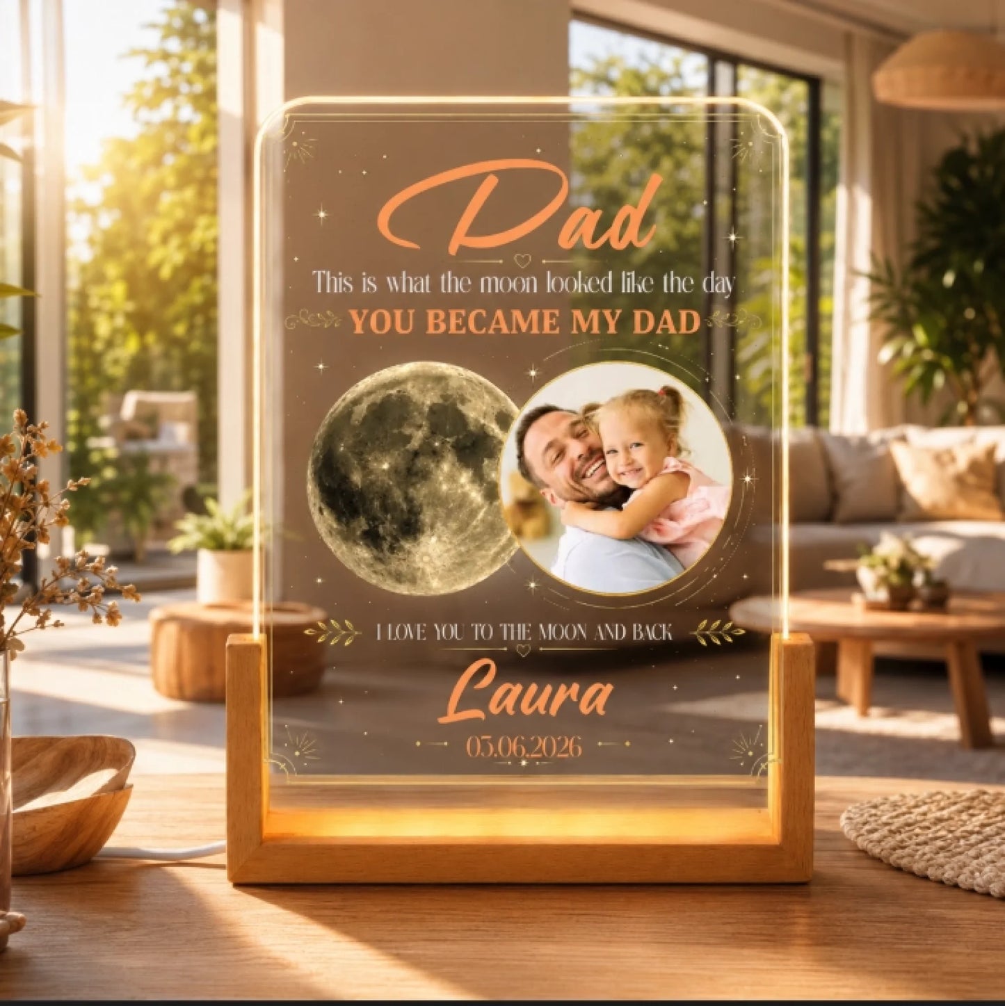 Personalized light-up frame with photo of a man and child, moon graphic, and text in a home setting.