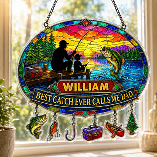 Stained glass panel with fishing design and personalized text, hanging in a bright room.