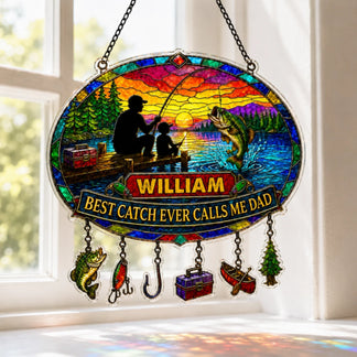 Stained glass panel with fishing theme and personalized text, hanging by a window.