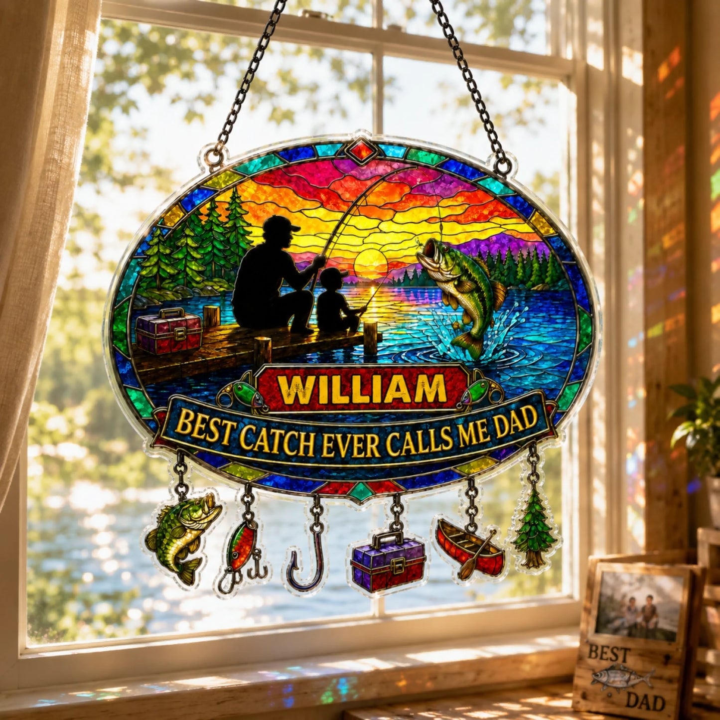 Stained glass panel with fishing design and 'William Best Catch Ever Calls Me Dad' text, hanging in a window.