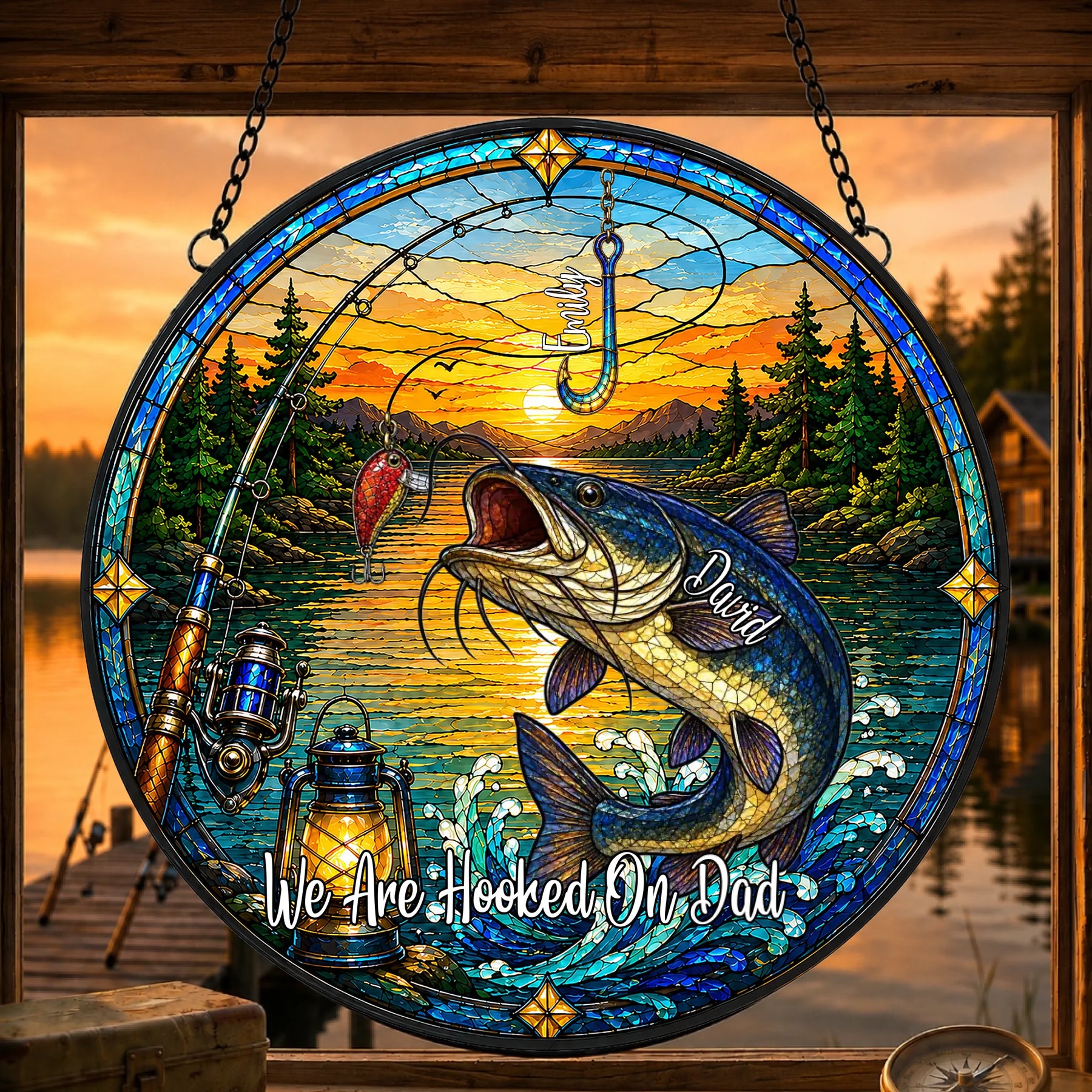 Stained glass artwork with a fish, fishing rod, and sunset over water scene.