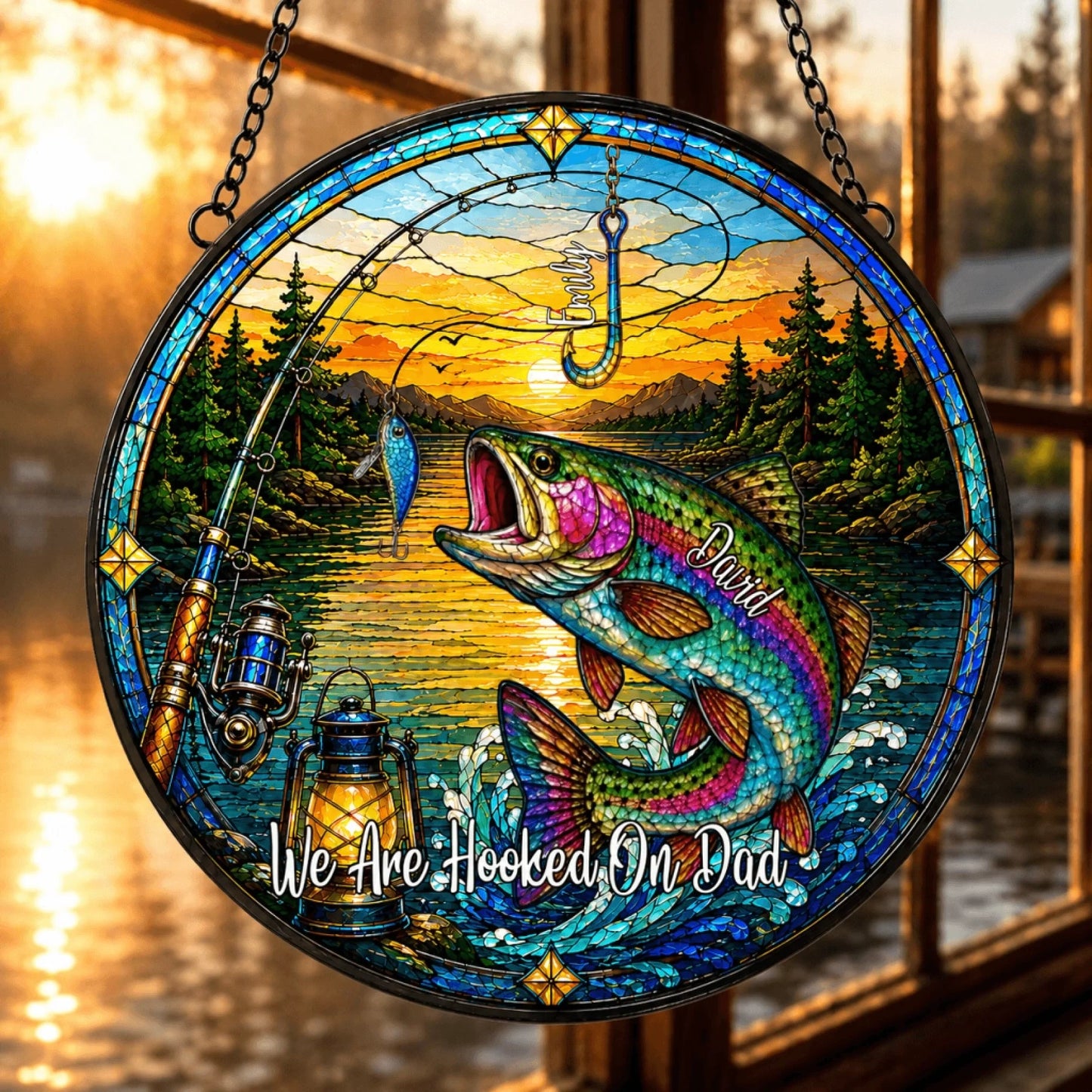Stained glass artwork with a fish, fishing rod, and sunset over water scene.