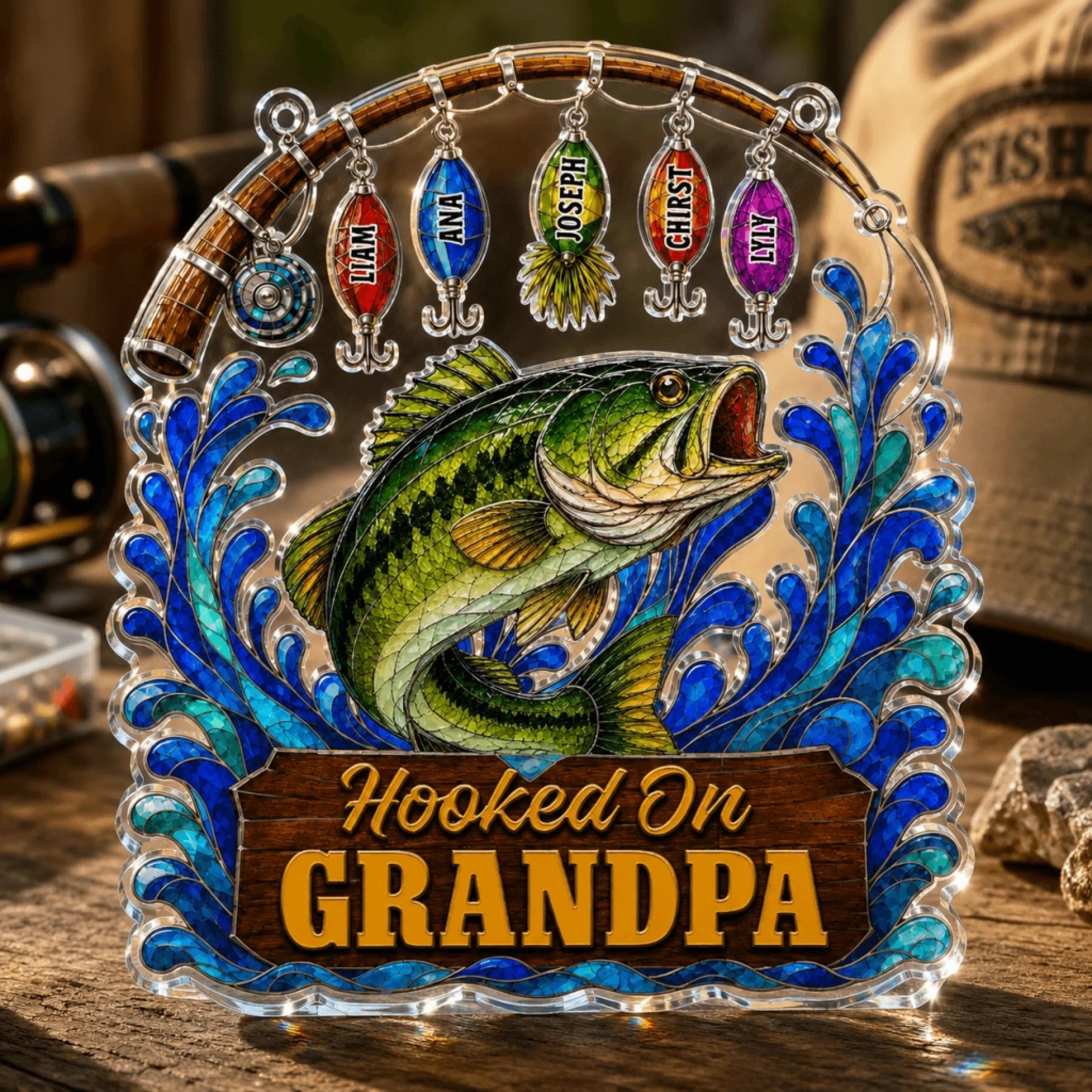 Decorative plaque with a fish design and 'Hooked On Grandpa' text, surrounded by fishing-themed items.
