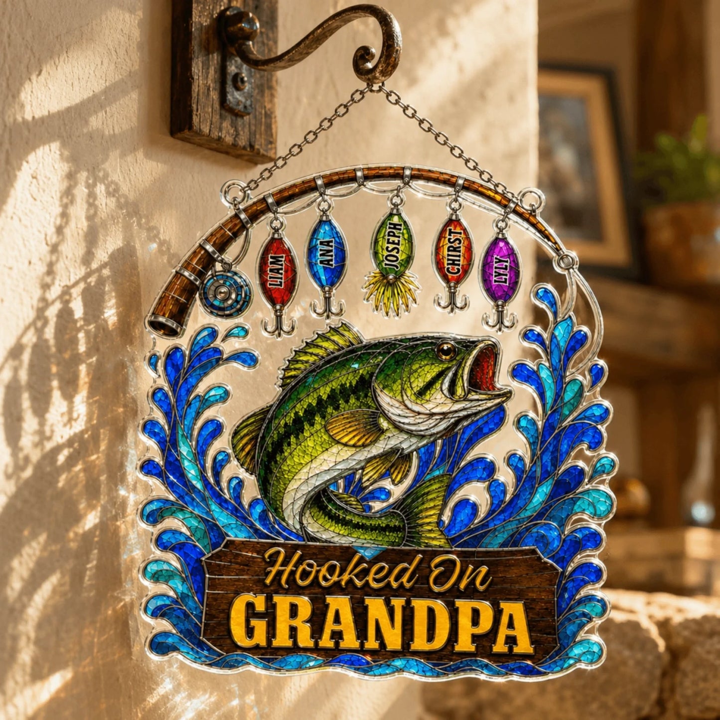 Decorative sign with a fish and colorful lures hanging, featuring the text 'Hooked On Grandpa'.