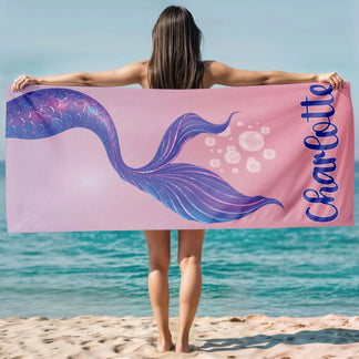 Custom pink mermaid tail beach towel for girls featuring the name Charlotte, ideal for summer vacation or pool gifts.
