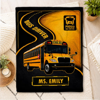 Soft personalized fleece throw blanket for bus drivers featuring a school bus graphic and the name Ms. Emily.