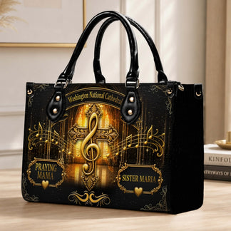 Stylish piano print handbag with the inspiring quote I Will Sing Of The Goodness Of God and musical elements.