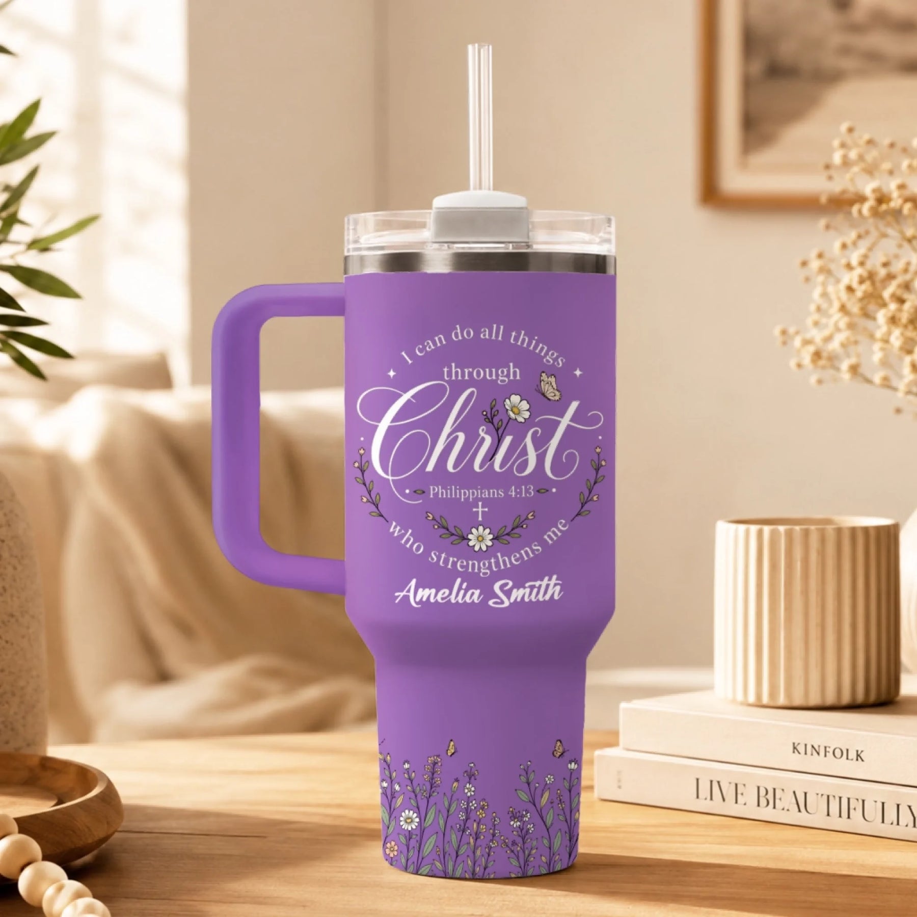 Purple stainless steel insulated tumbler with floral art and Philippians 4:13 verse text and personalized name.