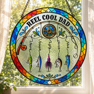 Stained glass panel with 'Reel Cool Dad' and fishing-themed design, hanging indoors.