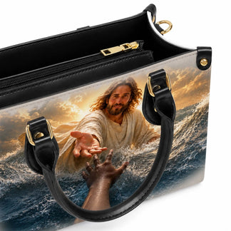 Religious handbag with an inspirational image of Jesus reaching out to help, ideal for a faith-inspired gift.