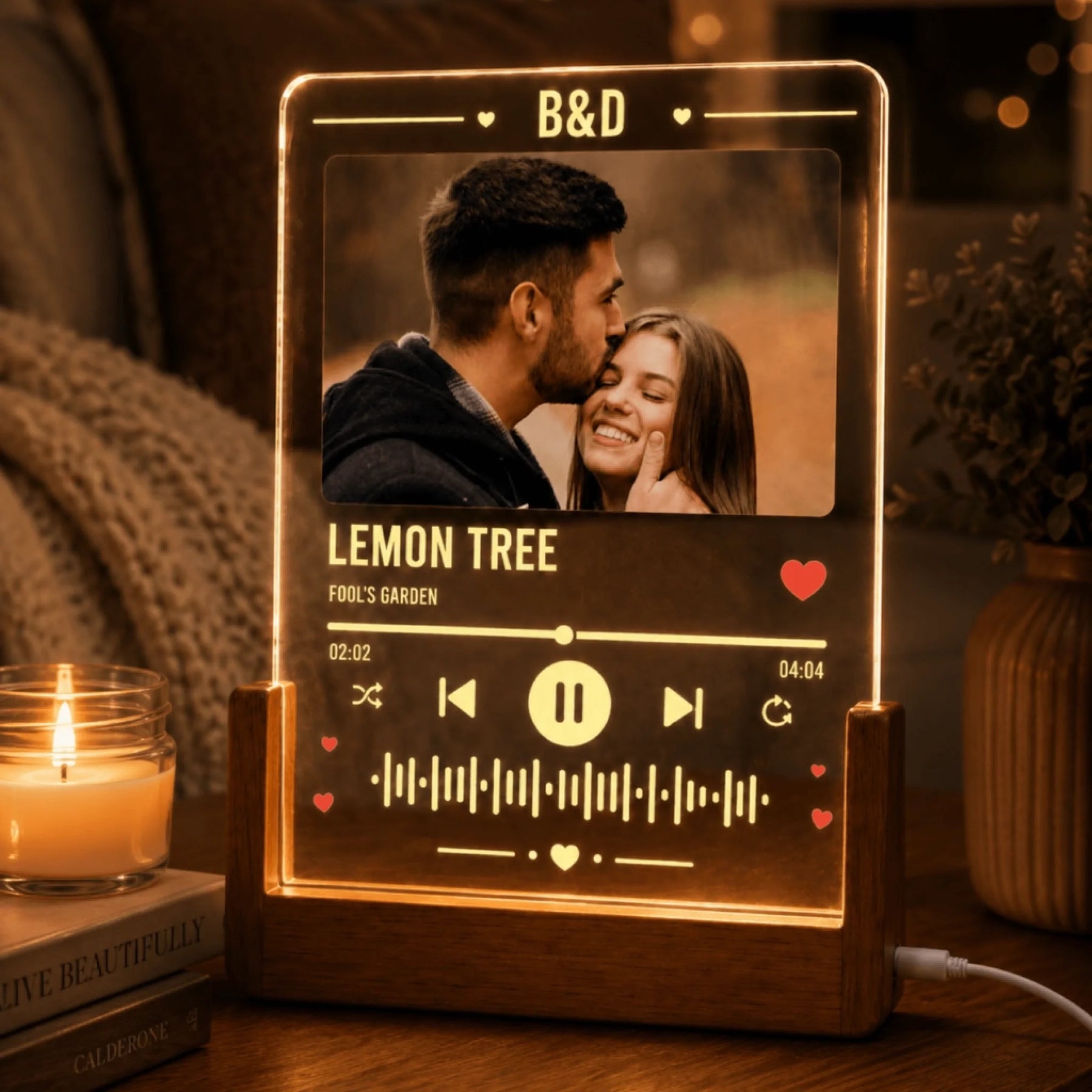 A custom music-themed acrylic lamp for couples, displaying a romantic photo and song details.