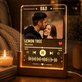 A custom music-themed acrylic lamp for couples, displaying a romantic photo and song details.