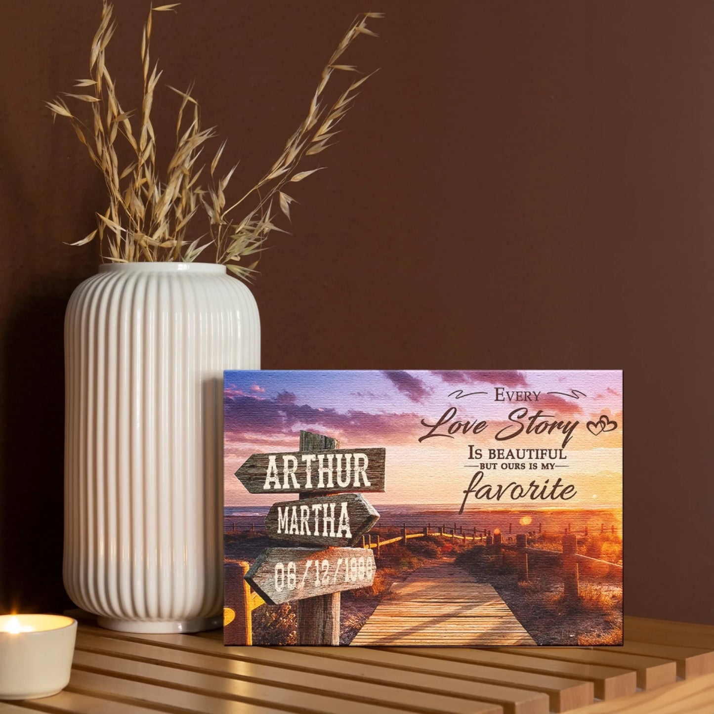 A beautiful sunset canvas print featuring a personalized wooden signpost with names and a date, ideal as a sentimental wedding gift.