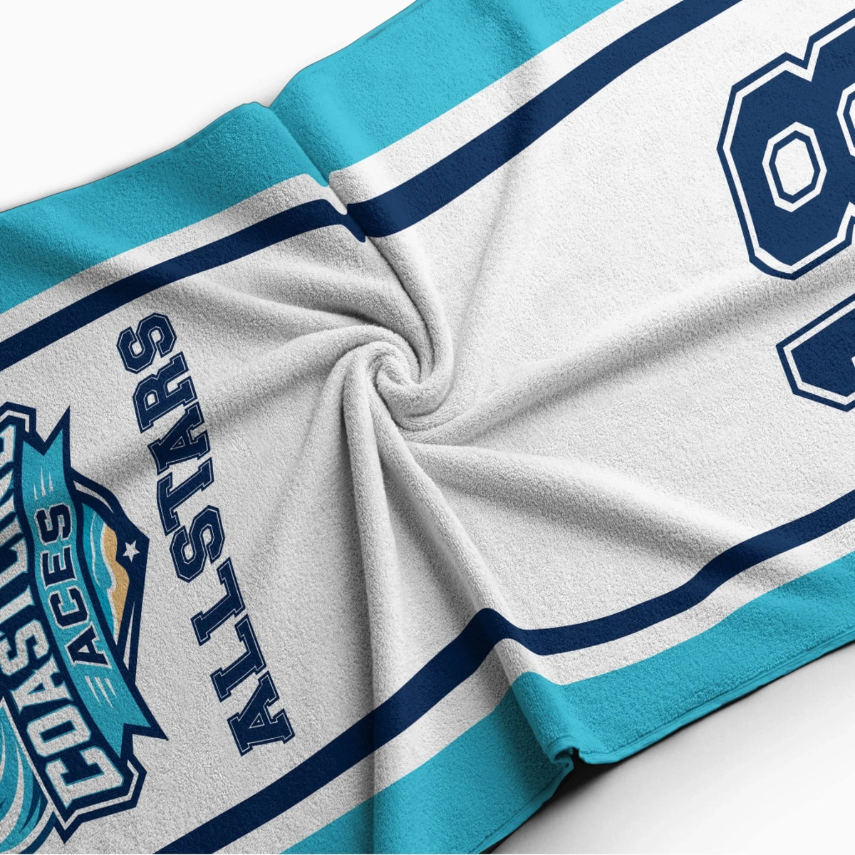 Soft texture detail of a personalized Coastline Aces Allstars beach towel with custom name and jersey number design.