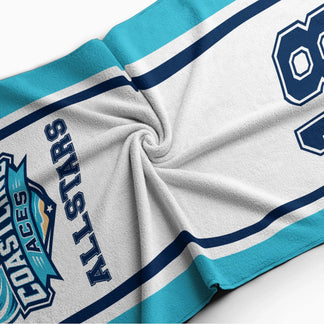 Soft texture detail of a personalized Coastline Aces Allstars beach towel with custom name and jersey number design.