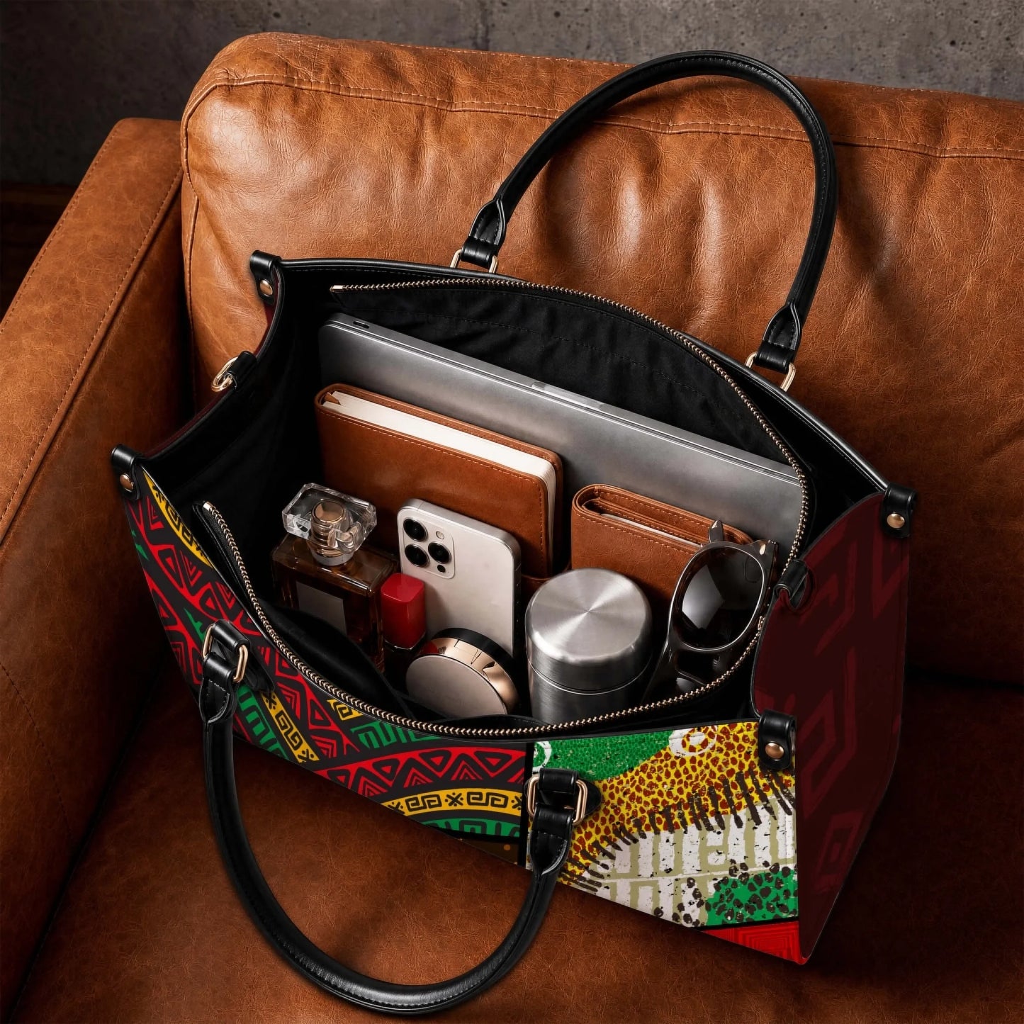 Spacious interior of a personalized grandma tote bag filled with everyday essentials like a laptop, phone, notebook, and sunglasses, showcasing its functional design.